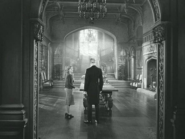 Joan Fontaine in Manderley's Great Hall Rebecca