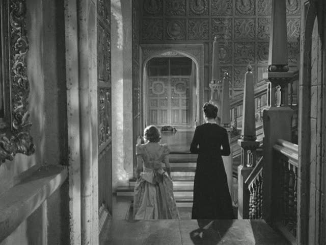 woman walking down steps with Mrs. Danvers in Manderley