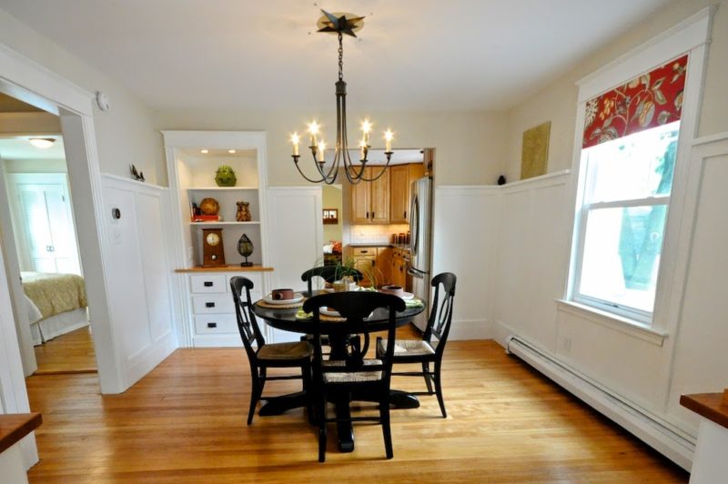 dining room with table and chairs and built in shelves