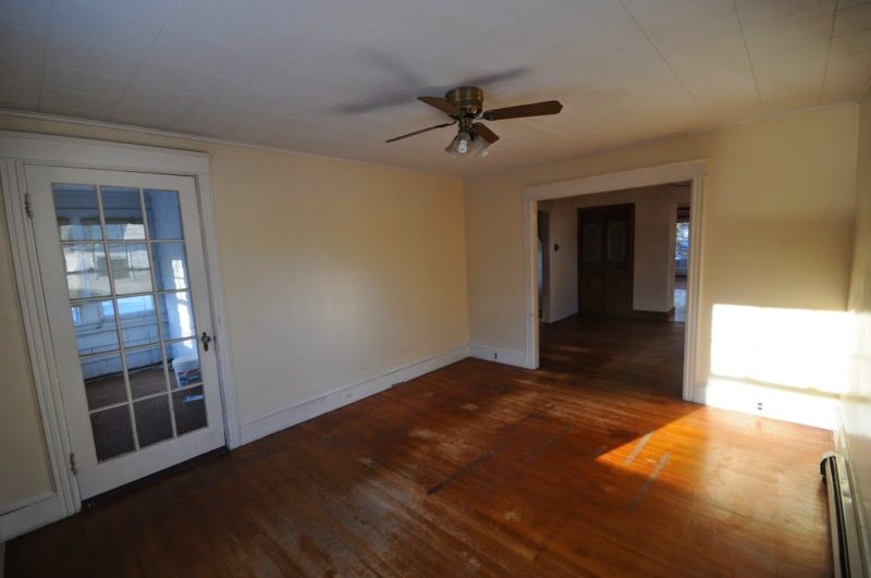 A large empty room with a wood floor