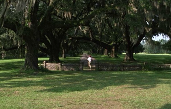 Forrest Gump runs down the lane in front of his house