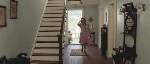 Mama Gump walks through entry hall of house