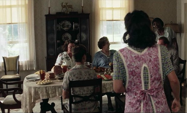 boarders eating at table in dining room