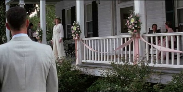 Jenny as a bride on front porch of house