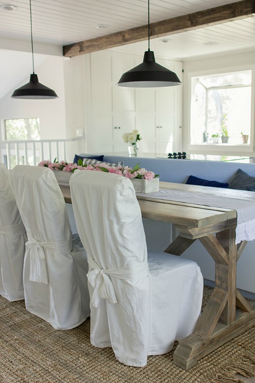 kitchen table with bench and slipcovered chairs