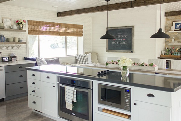 kitchen with white cabinets and beamed ceiling