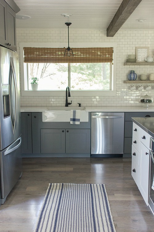 Jenna Sue\'s kitchen after makeover with blue gray cabinets and white subway tile