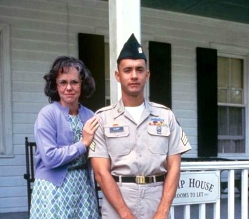 Sally Field and Tom Hanks stand in front of porch at Gump house