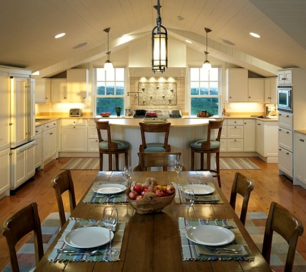 wide shot of kitchen with vaulted ceilings and white cabinets