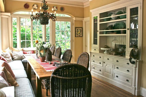 long dining table with wicker chairs