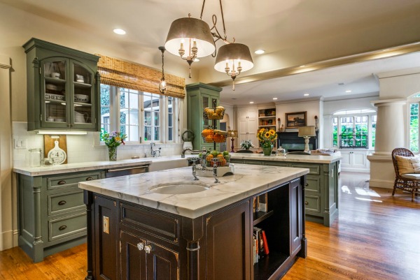 A kitchen with an island in the middle of a room