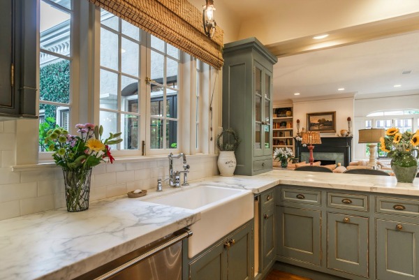 A kitchen with a sink and a window