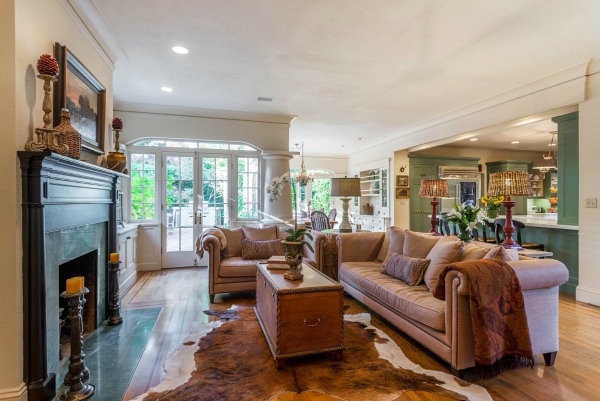 A living room filled with furniture and a fireplace