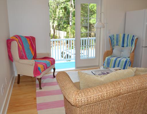 A living room filled with furniture and a window