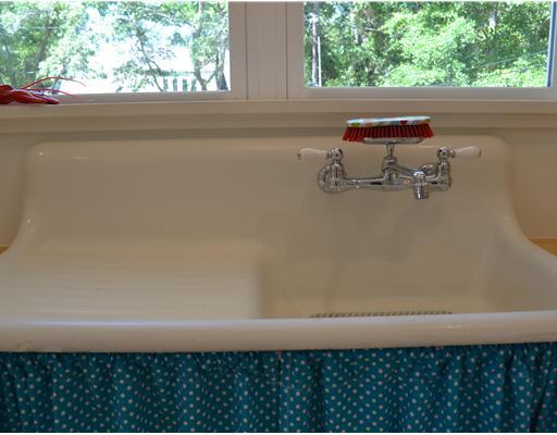 kitchen sink with teal fabric skirt