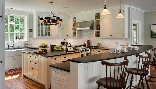 kitchen with white cabinets and black countertops