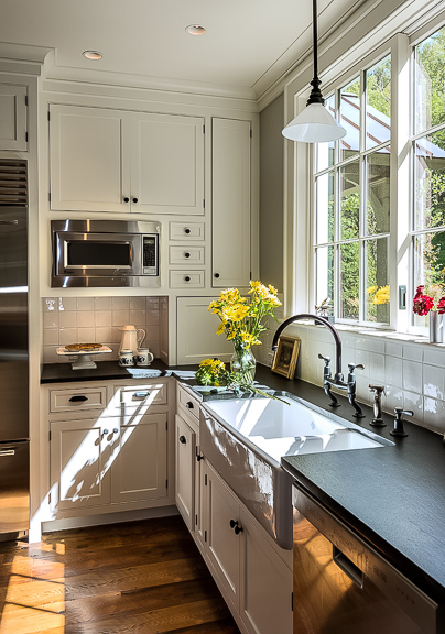 A kitchen with a sink and a window