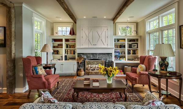 A living room filled with furniture and a fire place