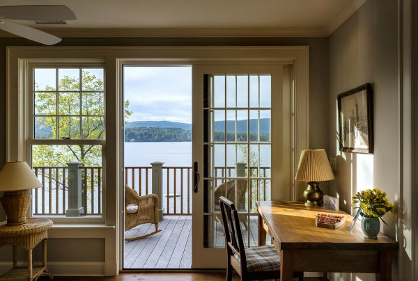 french doors open with view of the lake