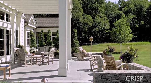 large stone patio behind house