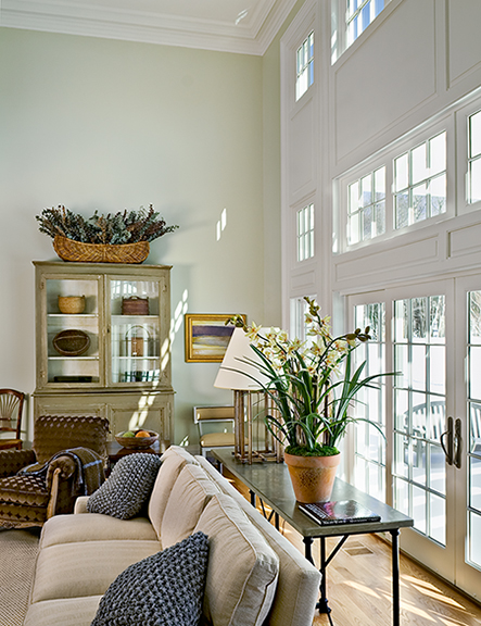 A living room filled with furniture and a large window