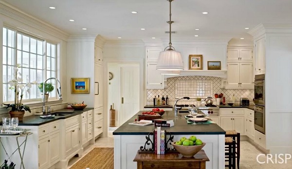 A kitchen with an island in the middle of a room