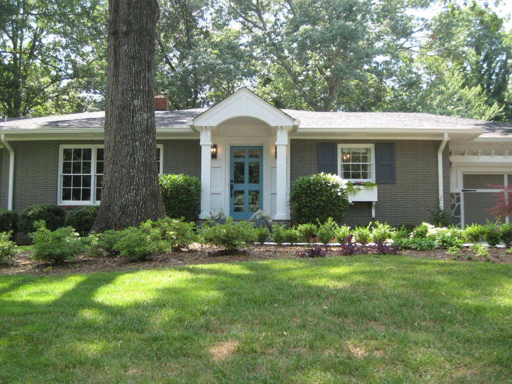 Painted House blog Brick Ranch exterior after painted gray with blue door