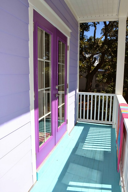 french doors painted purple on balcony of beach house