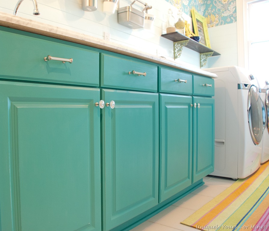 cabinets painted teal in laundry room