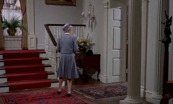 staircase with red runner in Boston townhouse 