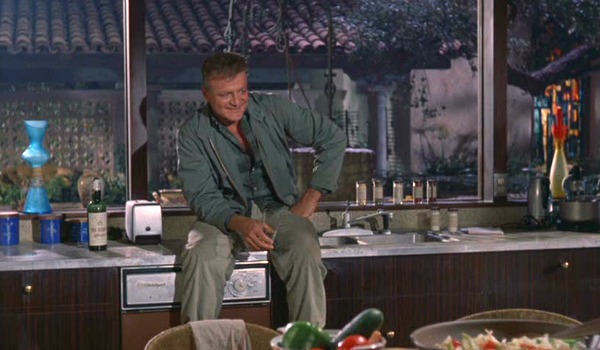 Brian Keith sitting on kitchen countertop