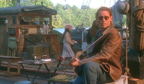 Johnny Depp playing guitar on houseboat