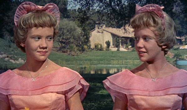 Hayley Mills playing twins in wedding scene with ranch house behind them