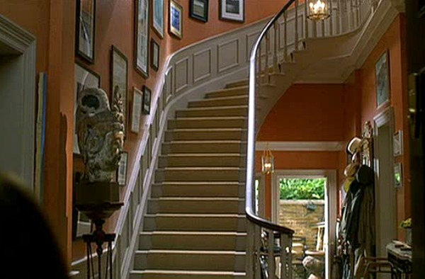 curving staircase in front entry of townhouse