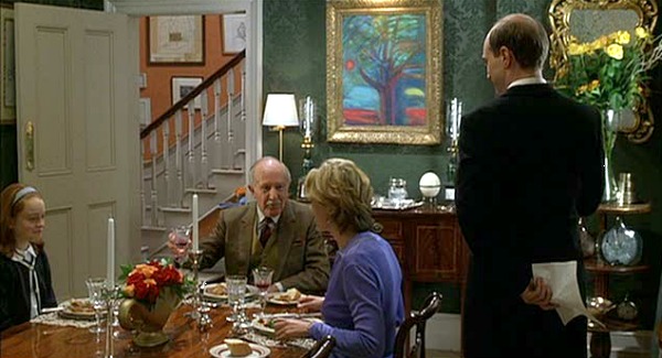 A group of people sitting at a table with wine glasses