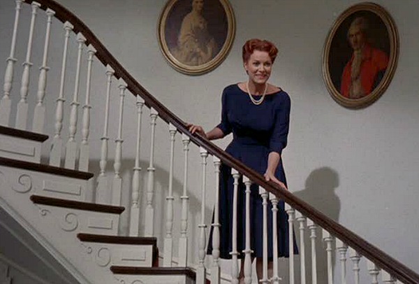 Maureen O\'Hara standing on the staircase in Parent Trap movie