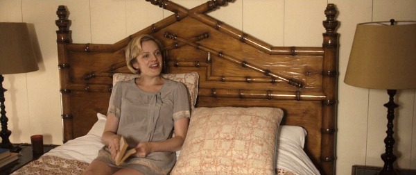 Elisabeth Moss sitting on bed