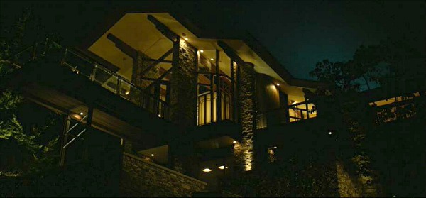 exterior of large lake house at night with lights on in Gone Girl
