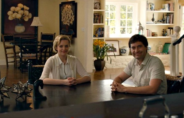 Mark Duplass and Elisabeth Moss sitting at dining table