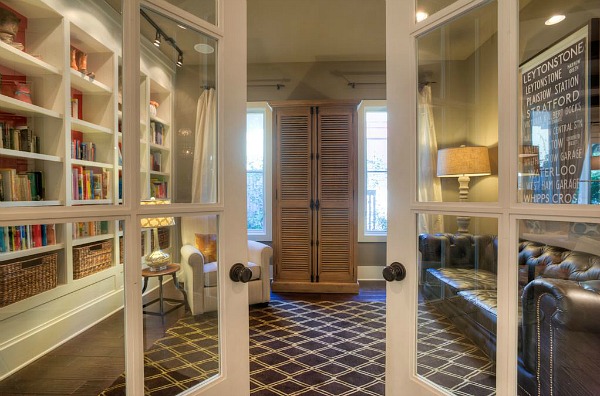 french doors leading to study with bookshelves