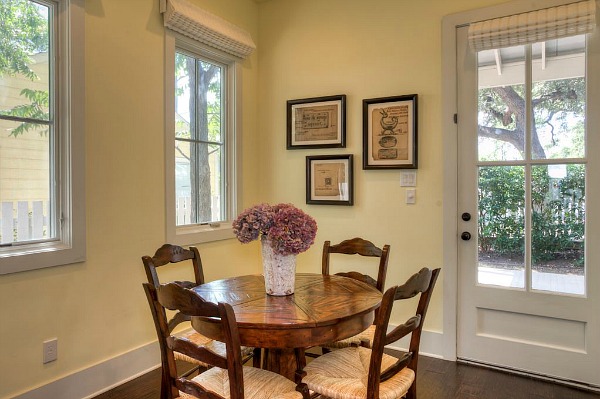 A dining room table in front of a window