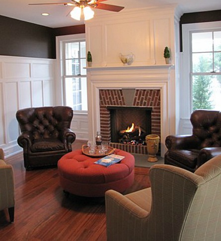 A living room filled with furniture and a fire place