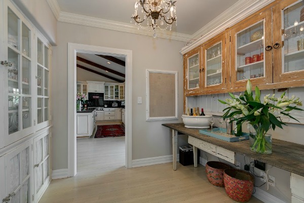 butlers pantry with chandelier