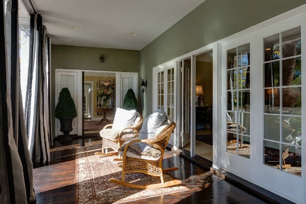 front porch with two wicker rocking chairs