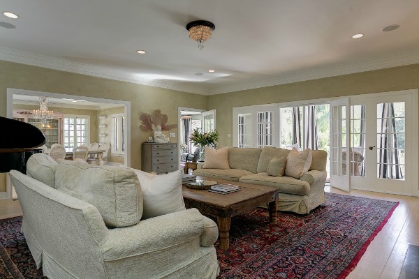 A living room filled with furniture and a large window