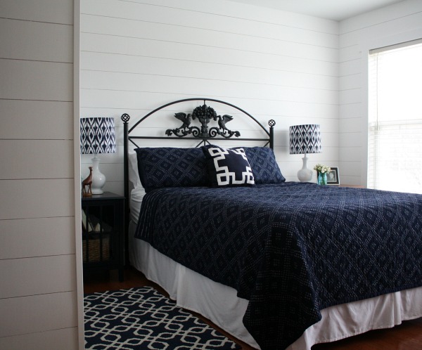 blue and white bedroom with fake shiplap on walls