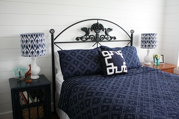 faux shiplap on wall of bedroom with queen size bed