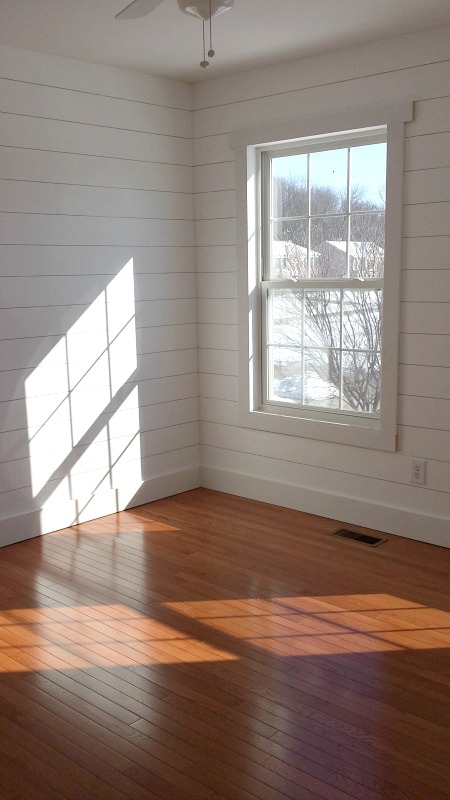 new hardwood floors and white shiplap in bedroom | hookedonhouses.net