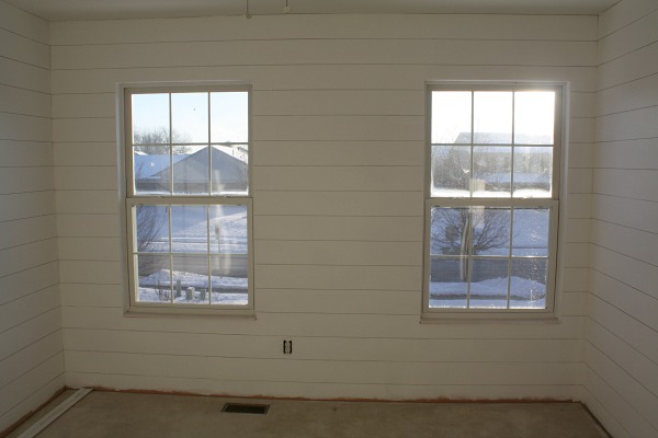 Shiplap hung and painted white