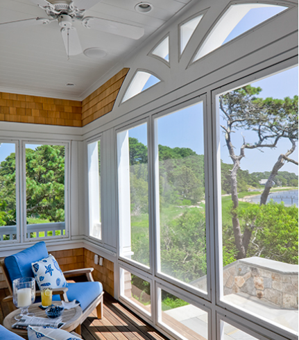 screened porch with blue chair